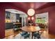 Charming kitchen features dark gray cabinets, butcher block island, stainless appliances, and a unique dining area at 2119 Glenwood Se Ave, Atlanta, GA 30316