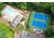 Aerial view of community amenities featuring a pool, a tennis court, and a playground at 2192 Nine Oaks Nw Dr, Kennesaw, GA 30152