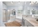 Bright bathroom featuring a large soaking tub, double vanity, walk-in shower, and natural light at 2192 Nine Oaks Nw Dr, Kennesaw, GA 30152