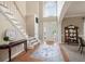 Open and airy foyer features hardwood floors and a grand staircase at 2192 Nine Oaks Nw Dr, Kennesaw, GA 30152