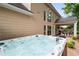 Relaxing hot tub with a covered patio, wood deck, and manicured landscaping to enhance your outdoor living experience at 2192 Nine Oaks Nw Dr, Kennesaw, GA 30152