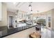 Kitchen and breakfast area features white cabinets, dark countertops, stainless appliances, and breakfast nook at 2192 Nine Oaks Nw Dr, Kennesaw, GA 30152