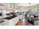 Eat-in kitchen with stainless steel appliances, island, granite countertops, and bright dining nook at 2192 Nine Oaks Nw Dr, Kennesaw, GA 30152
