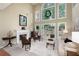 Bright living room featuring tall windows, fireplace, and comfortable seating area at 2192 Nine Oaks Nw Dr, Kennesaw, GA 30152