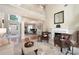 Formal living room with high ceilings, fireplace, and abundant natural light at 2192 Nine Oaks Nw Dr, Kennesaw, GA 30152