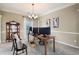 Cozy office space with neutral color palette, ample light, and room to work at 2192 Nine Oaks Nw Dr, Kennesaw, GA 30152