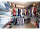 Organized walk-in closet featuring shelving, hanging rods, and ample storage space for clothing and accessories at 2192 Nine Oaks Nw Dr, Kennesaw, GA 30152