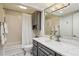 Bathroom featuring a shower-tub combo, vanity with a marble countertop, and decorative light fixture at 3650 Ashford Dunwoody Ne Rd # 811, Atlanta, GA 30319