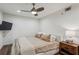 Bright bedroom with a ceiling fan, hardwood floors, and a nightstand with a lamp at 3650 Ashford Dunwoody Ne Rd # 811, Atlanta, GA 30319