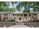 Brick condominium building featuring stately pillars and nicely landscaped common areas at 3650 Ashford Dunwoody Ne Rd # 811, Atlanta, GA 30319