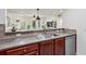 Bright kitchen area features a stainless steel sink, modern faucet, and views into the living space at 3650 Ashford Dunwoody Ne Rd # 811, Atlanta, GA 30319