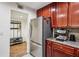 Updated kitchen features stainless steel appliances and an adjacent storage area with a coat rack and shoe storage at 3650 Ashford Dunwoody Ne Rd # 811, Atlanta, GA 30319