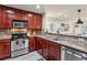 Modern kitchen with stainless steel appliances and dark wood cabinetry at 3650 Ashford Dunwoody Ne Rd # 811, Atlanta, GA 30319