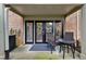 Private patio area featuring a table with two chairs, with access through glass paneled doors at 3650 Ashford Dunwoody Ne Rd # 811, Atlanta, GA 30319
