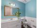Bathroom featuring a vanity, mirror and toilet at 1433 Janice Sw Ct, Lilburn, GA 30047