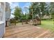 Wood deck and backyard with lawn and mature trees at 1433 Janice Sw Ct, Lilburn, GA 30047