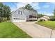 Charming home with attached garage, long driveway, and covered front porch at 1433 Janice Sw Ct, Lilburn, GA 30047