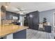 Well-equipped kitchen featuring stainless appliances, granite counters, and grey cabinetry at 1433 Janice Sw Ct, Lilburn, GA 30047