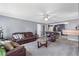 Open-concept living room showcasing comfortable seating and seamless flow into the adjacent kitchen at 1433 Janice Sw Ct, Lilburn, GA 30047