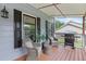 Charming covered porch with wood flooring and furniture, perfect for relaxing outdoors at 1433 Janice Sw Ct, Lilburn, GA 30047