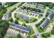The aerial view highlights a neighborhood's attractive arrangement of townhomes, landscaping, and community parking areas at 217 Odyssey Turn, Conyers, GA 30012