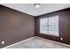 Bedroom showcasing a window with bright natural light and neutral colored carpet at 217 Odyssey Turn, Conyers, GA 30012