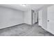 Bedroom with carpet, neutral walls, white doors and fixtures at 217 Odyssey Turn, Conyers, GA 30012