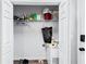 Functional laundry area with shelving and a washer-dryer, offering convenient storage and organization solutions at 217 Odyssey Turn, Conyers, GA 30012