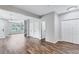 Inviting living area with hardwood floors and open layout leading to other rooms, perfect for Gathering gatherings and relaxation at 217 Odyssey Turn, Conyers, GA 30012