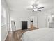 Inviting bedroom with ceiling fan, modern dresser, full-length mirror, and ensuite bathroom entrance at 434 Teal Ct, Roswell, GA 30076