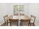 Cozy dining room features modern table and chairs in natural light at 434 Teal Ct, Roswell, GA 30076