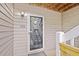This entryway shows the door to unit 434, stairs and wood siding at 434 Teal Ct, Roswell, GA 30076