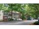 Well-maintained apartment building with ample parking and mature landscaping at 434 Teal Ct, Roswell, GA 30076
