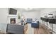 Inviting living room with a fireplace, breakfast bar, and open layout, perfect for entertaining and relaxation at 434 Teal Ct, Roswell, GA 30076