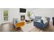 Bright living room featuring a fireplace, hardwood floors, and a comfortable seating area with natural light at 434 Teal Ct, Roswell, GA 30076