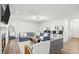 Open-concept living room with modern decor, a fireplace, and a breakfast bar overlooking the kitchen at 434 Teal Ct, Roswell, GA 30076