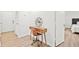 Stylish office space features a wooden desk, modern chair, hardwood floors, and contemporary wall clock at 434 Teal Ct, Roswell, GA 30076