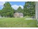Two-story brick home with a well-manicured lawn and mature trees at 4438 Parmalee Path, Conley, GA 30288