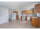 A large kitchen with wooden cabinets and white appliances at 4438 Parmalee Path, Conley, GA 30288