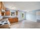 A well-lit kitchen with wood cabinets, laminate countertops, and modern appliances at 4438 Parmalee Path, Conley, GA 30288