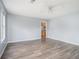 Bright living room features ceiling fan and wood look floors, providing a clean and modern space at 4438 Parmalee Path, Conley, GA 30288