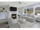 Bright living room with fireplace, built-in shelves, neutral colors, and lots of natural light at 4438 Parmalee Path, Conley, GA 30288