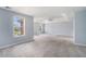 Spacious main bedroom with tray ceilings, fan, and large window at 4438 Parmalee Path, Conley, GA 30288