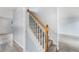 Carpeted staircase with wooden railing leads to the upper level of the home at 4438 Parmalee Path, Conley, GA 30288