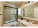 Neutral bathroom featuring a shower-over-tub with sliding glass door, granite countertops, and vanity at 5284 Vernon Springs Nw Trl, Sandy Springs, GA 30327