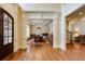 Inviting dining room with hardwood floors, decorative columns, and arched entrance to the home at 5284 Vernon Springs Nw Trl, Sandy Springs, GA 30327