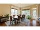 Bright dining room featuring large windows, a wood table, and views of the outdoors at 5284 Vernon Springs Nw Trl, Sandy Springs, GA 30327