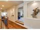 Elegant hallway with hardwood floors, detailed trim, and decorative nooks that lead to the main living area at 5284 Vernon Springs Nw Trl, Sandy Springs, GA 30327