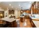 Open-concept kitchen featuring a breakfast bar, stainless appliances, and hardwood floors at 5284 Vernon Springs Nw Trl, Sandy Springs, GA 30327