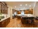 Gourmet kitchen with custom wood cabinets, stainless steel appliances, and hardwood floors at 5284 Vernon Springs Nw Trl, Sandy Springs, GA 30327